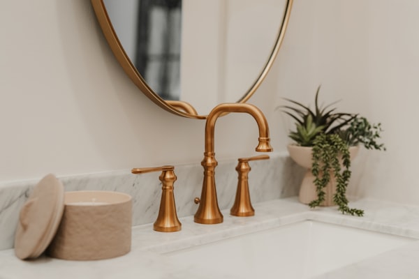 Quality brass plumbing fixtures on marble countertop